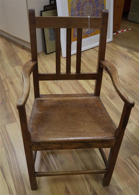 A set of six early 19th century provincial wood seat chairs (one with arms)